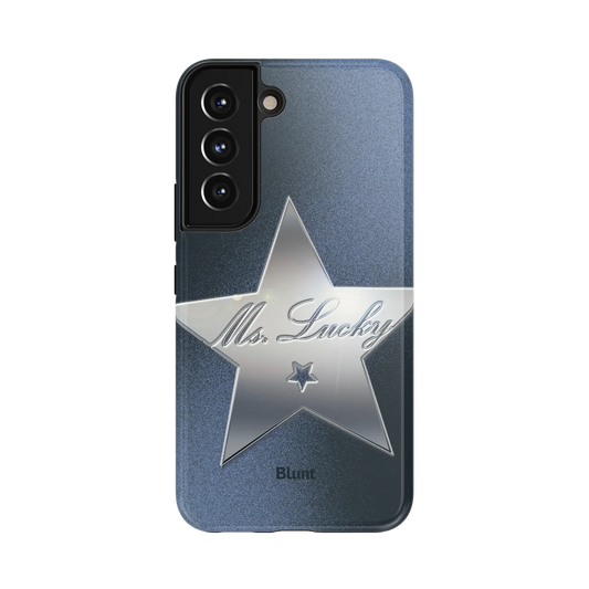 Miss Lucky Samsung Case: a gleaming silver star with cursive 'Ms. Lucky' lettering set against a rich grey tone
