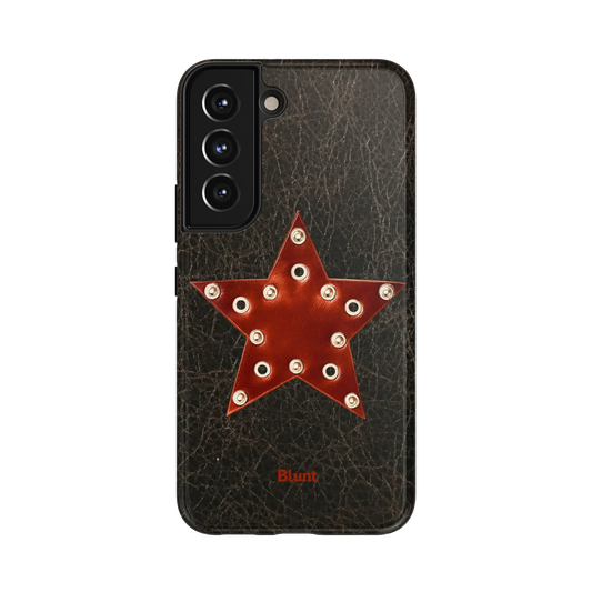 Rust Star Samsung Case: a brown leather star with silver grommets on a textured black background